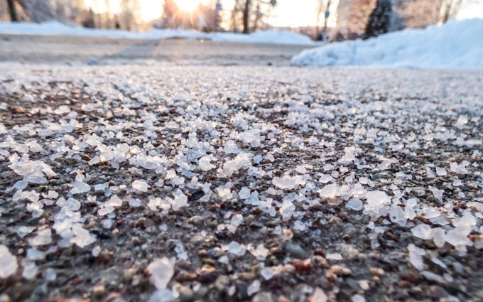 close up on de-icing salts on pavement